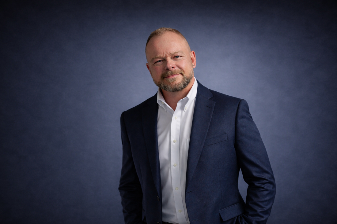 Chuck Kinney in a navy suit